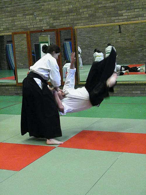 an uke mid-flight in mae ukemi from a kote gaeshi throw after attacking the nage.